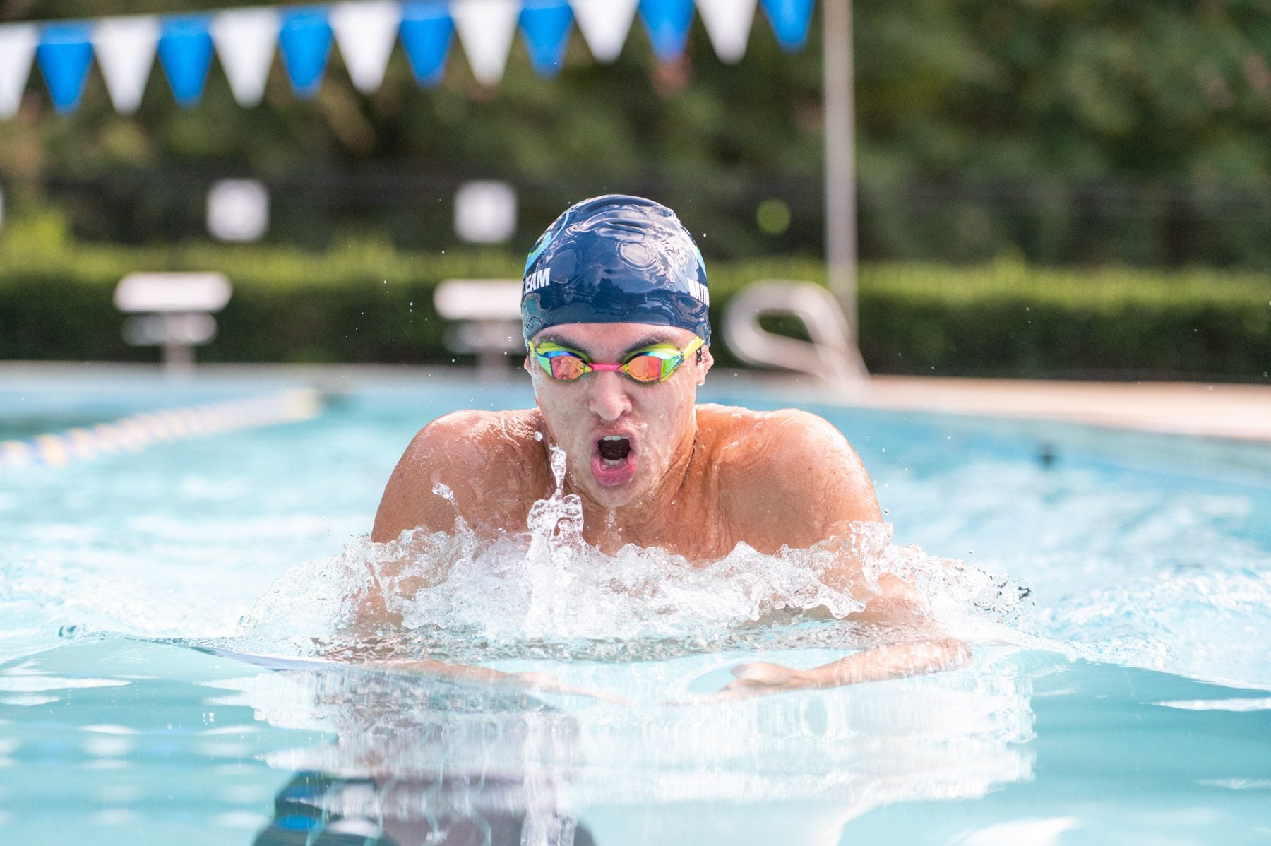 A swimmer glides down the pool in breaststroke at Hollow Rock Racquet and Swim Club