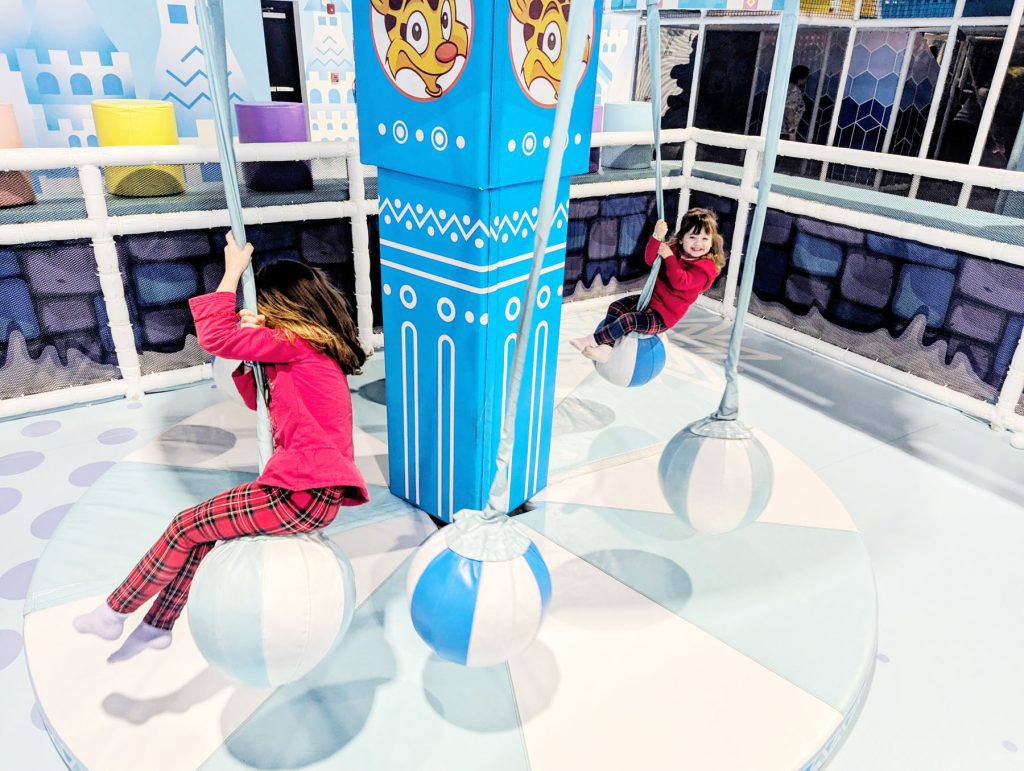 Sisters Daphne Dodge and Felicity Dodge swing together at Hyper Kidz.