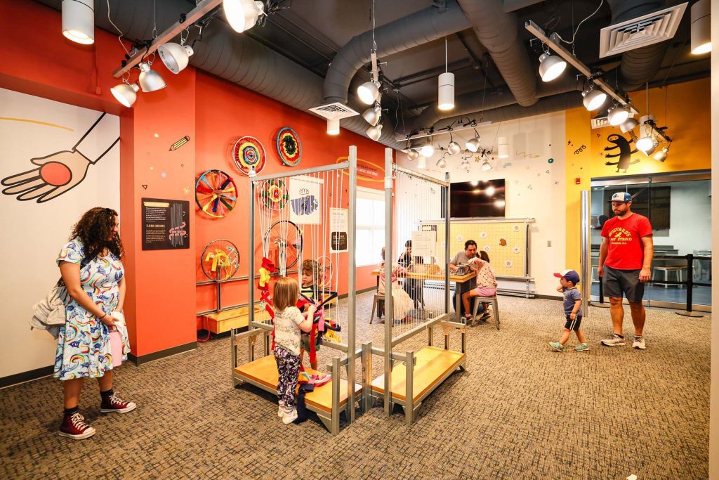 Families play in the TinkerLab at the Museum of Life and Science in Durham