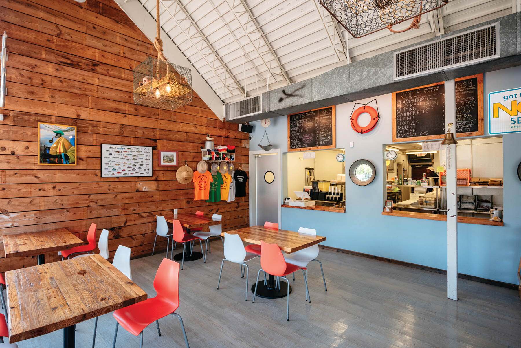 The dining room and open kitchen at Saltbox Seafood Joint.