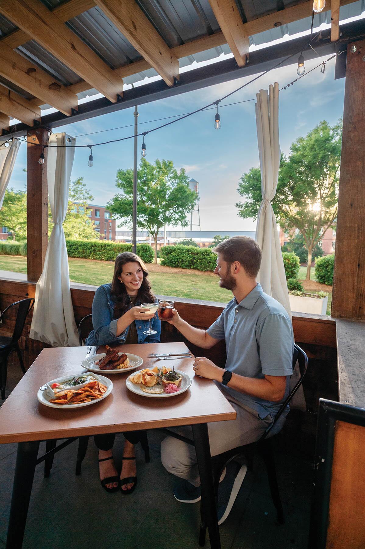 A couple shared a toast over dinner at NanaSteak.