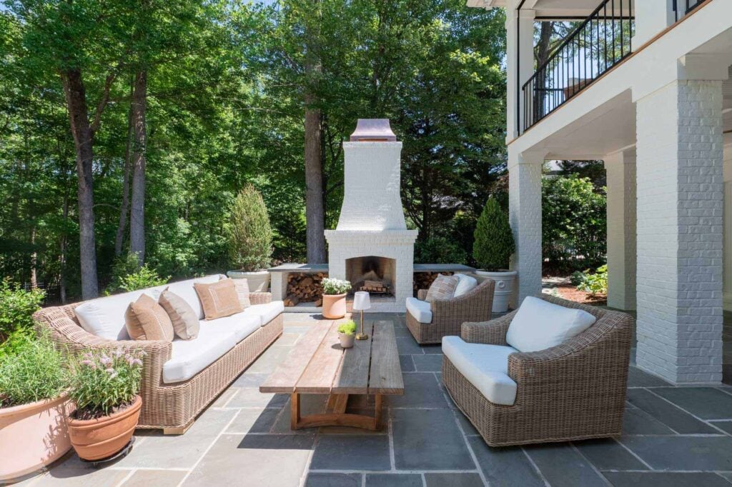 The outdoor living room and brick fireplace on the Serrano's patio.