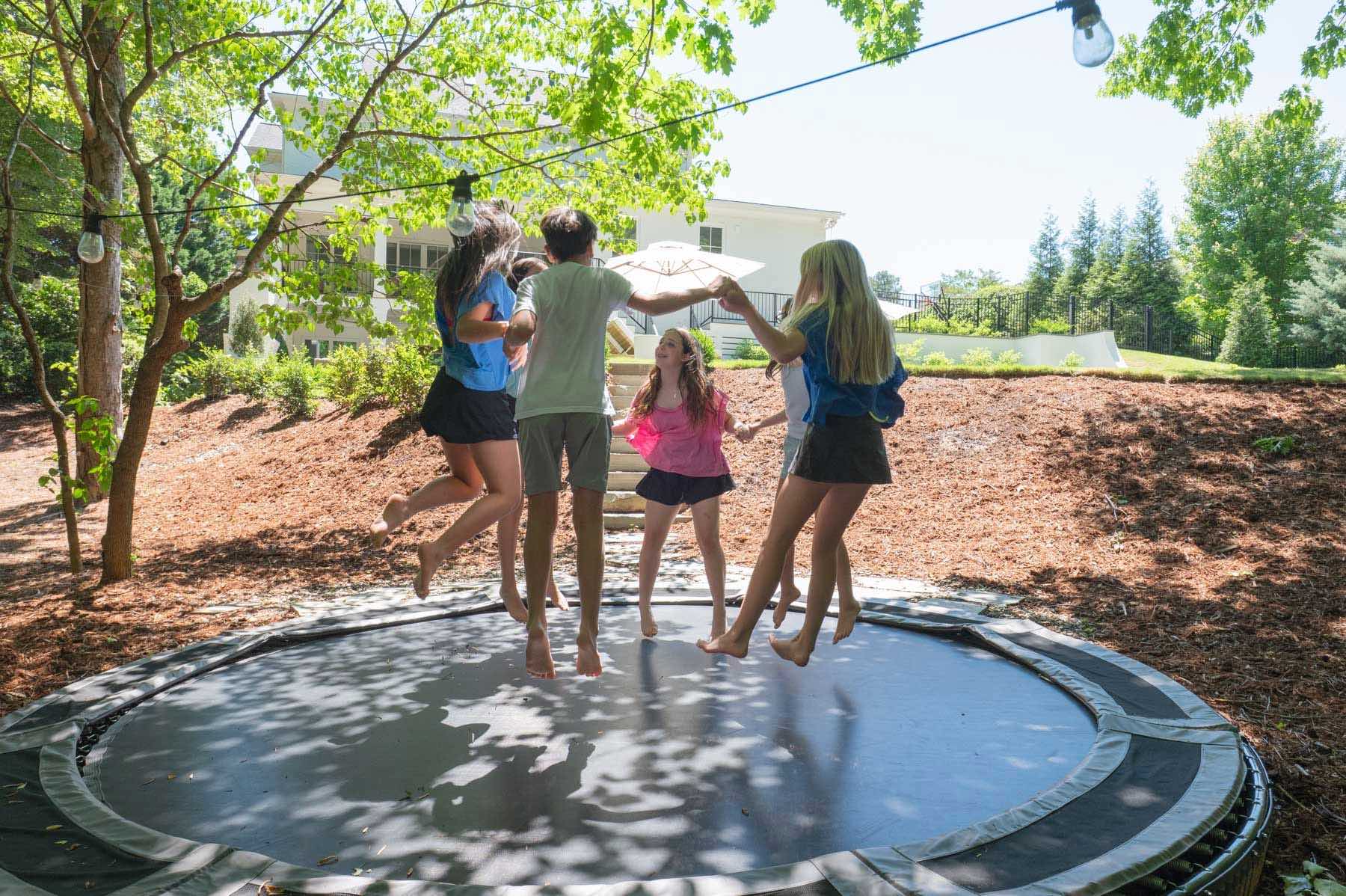 The in-ground trampoline in the Serrano's back yard.