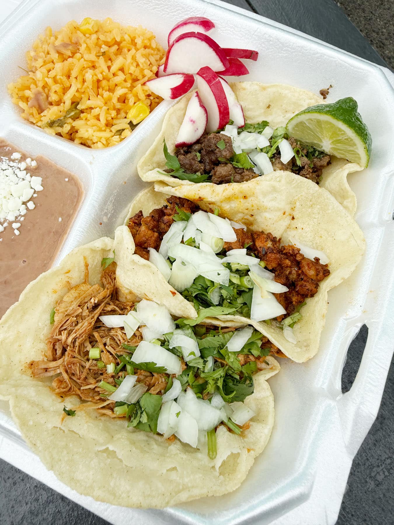 A tray of tacos, rice and beans at La Vaquita.