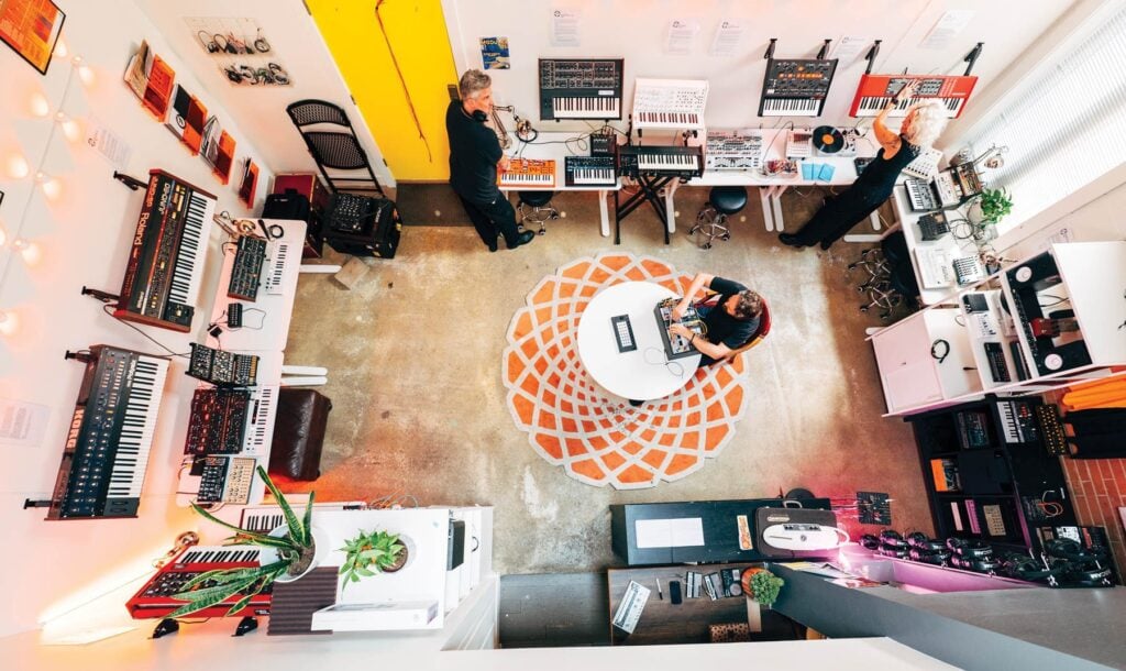 Musicians use synthesizers and electronic instruments in BOOM Club’s shared gear library